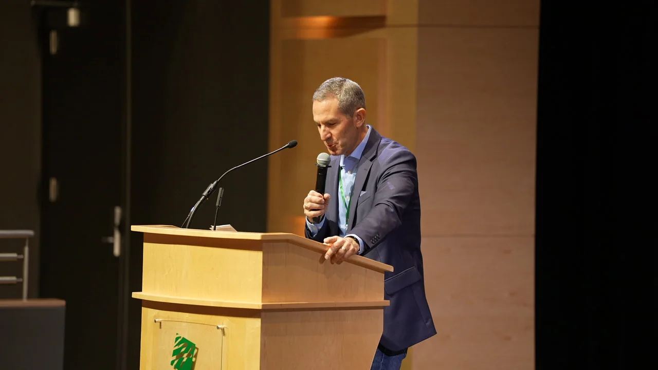 A QxBio speaker presenting at the conference